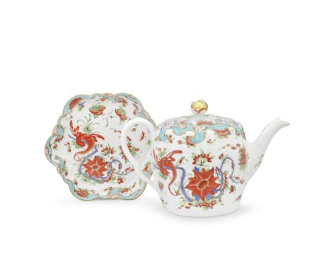 A Worcester teapot, cover and stand, circa 1770Of fluted form, the teapot with an ear-shaped handle, the low cover with an op