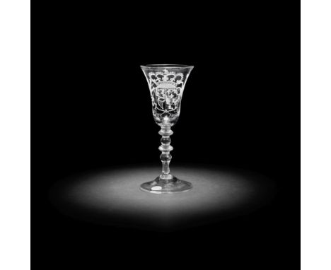 A Dutch engraved Royal armorial light baluster wine glass, circa 1750The bell bowl with the English arms of Anne, Princess Ro