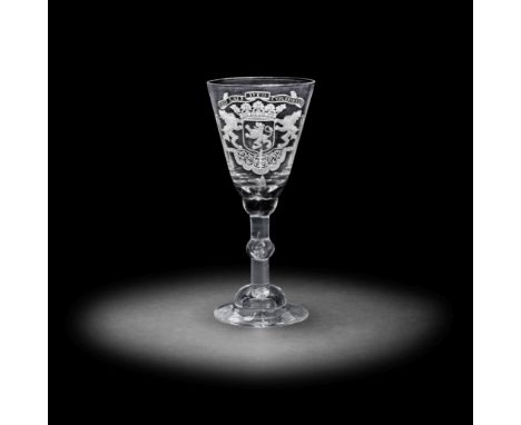 A Dutch engraved armorial light baluster wine glass, circa 1750The generous round funnel bowl with the crowned arms of South 