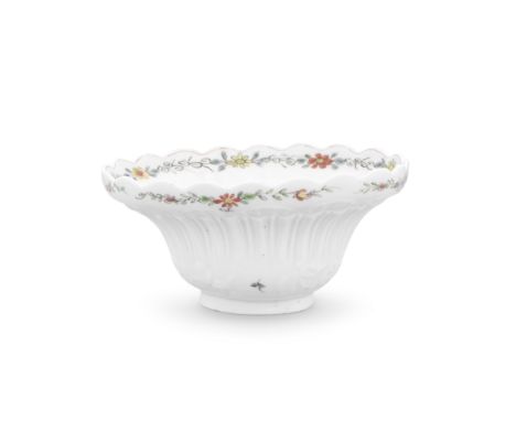 A very rare Worcester sugar bowl, circa 1752-3The oval flared bowl of double ogee section moulded all around with rococo shel