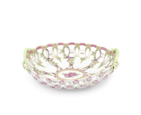 A Worcester dessert basket, circa 1770-75Of oval form, the rim pierced with interlocking circles, florets applied to the exte