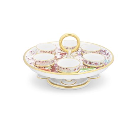A remarkable Barr, Flight and Barr Worcester egg cup stand and six egg cups, circa 1810The circular footed tray with a raised