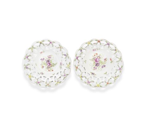 A pair of Worcester baskets, circa 1770Of circular form, the flared sides pierced with interlocking circles, purple and green