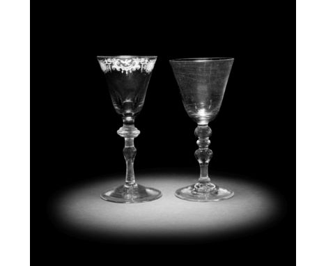 Two light baluster wine glasses, circa 1750With round funnel bowls and plain conical feet, one Dutch engraved with a formal b