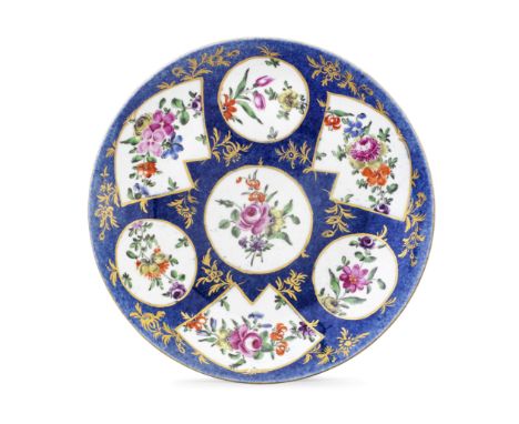 A Worcester powder blue saucer dish, circa 1765En suite to the previous lot, the powder blue ground reserving panels of forma