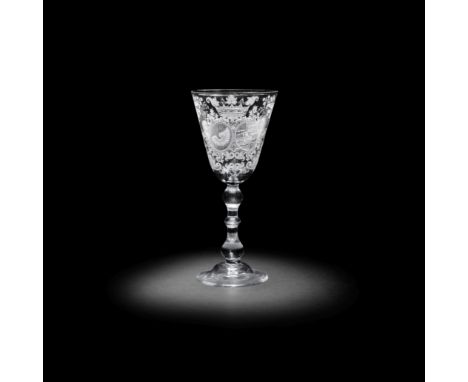 A very fine Dutch engraved armorial light baluster marriage goblet, circa 1760The generous round funnel bowl with an elaborat