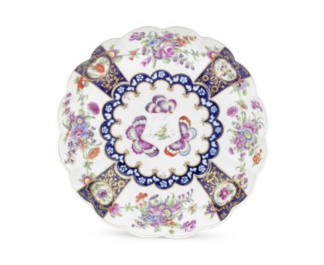 A good Worcester junket dish, circa 1770Of lobed form, the centre painted with three brightly coloured moths and a floral spr