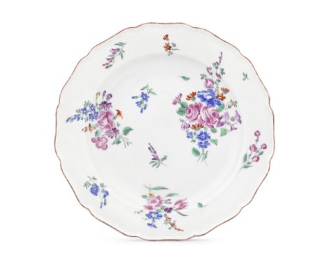A Worcester plate, circa 1770-75With a lobed edge in Meissen style, painted in the Giles workshop with bouquets and scattered