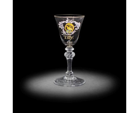 A very rare Beilby enamelled armorial light baluster 'Tilly' wine glass, circa 1765-69The round funnel bowl finely decorated 