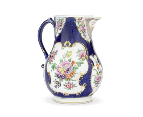 A fine Worcester mask jug, circa 1770-75Of pear shape on a neatly turned foot, with a scrolled handle, the spout moulded with