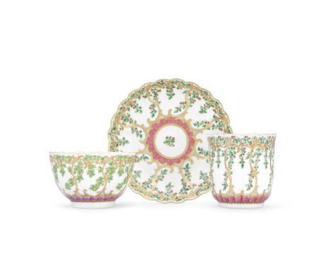 A Worcester teacup, coffee cup and saucer, circa 1770-75Of reeded French shape, richly decorated in Sèvres style with berried