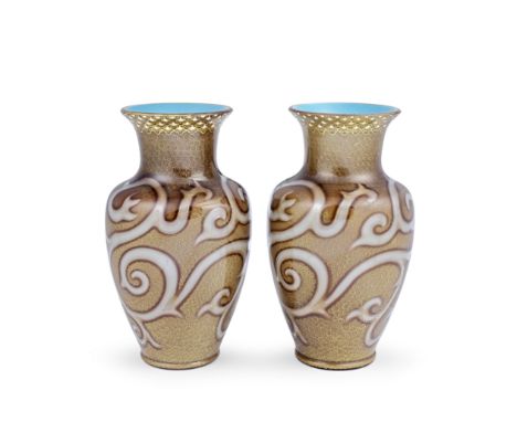 A fine pair of Loetz 'Octopus' vases, circa 1888Of baluster form with air trap decoration, in opaque turquoise glass overlaid