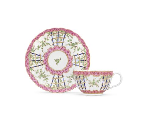 A Worcester teacup and saucer, circa 1775Of reeded French shape, painted with a version of the 'Hop Trellis' pattern with swa