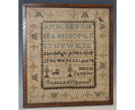 A George IV needlework sampler, embroidered by Susannah Spence, from Matlock School, with alphabet, stylised dog and trees wi