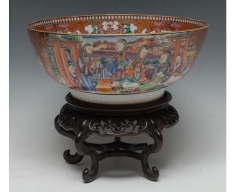 An 18th century Chinese Export porcelain circular punch bowl, painted in colourful polychrome with a family enjoying the frui