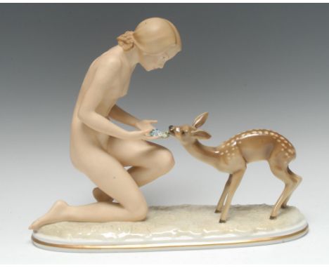 An Art Deco Hutschenreuther porcelain figural group, Gute Freunde, modelled by Carl Werder, as a nude feeding a deer, painted