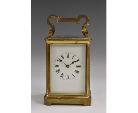 A 19th century brass carriage clock, Roman numerals, white enamel dial, beval glass, swing handle, 16cm high, c.1890