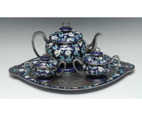 A Korean silver coloured metal four piece tea service, enamelled with stylised flowers and scrolls in white and turquoise on 