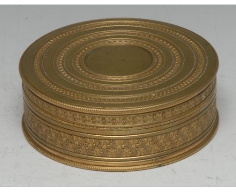 A 19th century Polish circular gilt metal metal table snuff box, in the Imperial Russian taste, engine turned in bands, push-