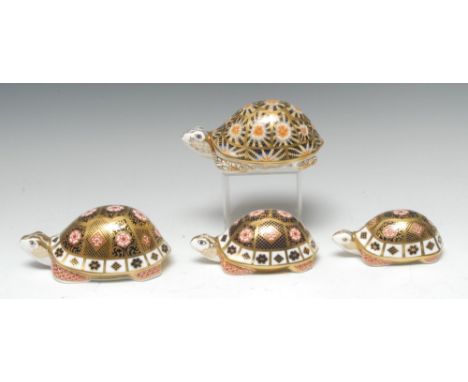 A set of three graduated Royal Crown Derby paperweights, The Yorkshire Rose Tortoise Family, exclusive to Peter Jones of Wake