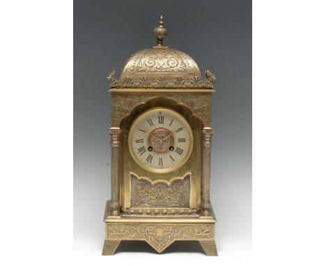 A 19th century Orientalist brass portico mantel clock, 10cm silvered dial inscribed with Roman numerals, twin-winding holes, 