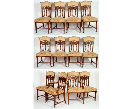 A set of twelve late Victorian mahogany dining chairs, comprising ten side chairs and a pair of carvers, shaped and pierced b