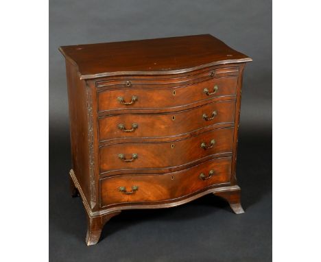 A Chippendale Revival mahogany serpentine bachelor's chest, moulded top above a slide and four long graduated cockbeaded draw