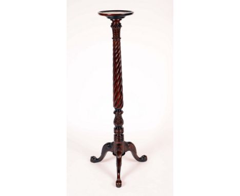 A Chippendale Revival style mahogany tripod torchere, dished circular top, spirally fluted pillar with acanthus capitol and s
