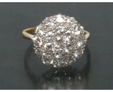 A diamond cluster ring,  circular cluster of nineteen round old brilliant cut diamonds, measuring between approx 0.07 and 0.1