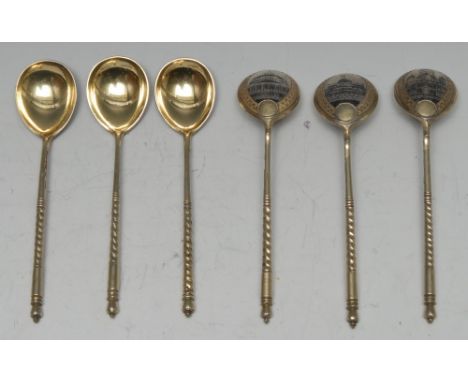 A set of six Russian silver-gilt and niello spoons, each bowl decorated to verso with a city building, twisted haft, 13cm lon