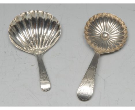 A George III silver caddy spoon, fluted circular bowl, bright-cut engraved stem, 8.5cm long, Birmingham 1798; another, London