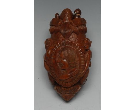 An 18th century French coquilla nut snuff bottle, carved in the Baroque taste with a a portrait roundel of a nobleman and fla