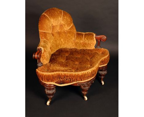 A Victorian walnut drawing room corner chair, scroll arms, turned legs carved with scrolling acanthus, stuffed over deep butt