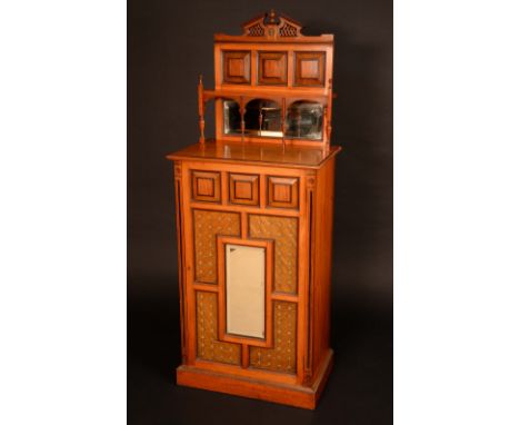 An Aesthetic Movement walnut side cabinet, in the manner of Bruce Talbert (1838-1881), break-arch cresting above a shelf and 