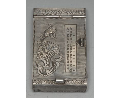 A Continental silver mechanical index aide memoir, hinged cover with sliding indicator and alphabetical scale, bright-cut eng
