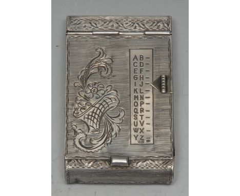 A Continental silver mechanical index aide memoir, hinged cover with sliding indicator and alphabetical scale, bright-cut eng