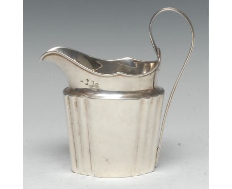 A George III Irish silver commode shaped cream jug, lofty scroll handle, 13.5cm high, Dublin 1795