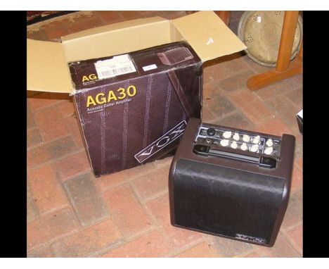 A Vox acoustic guitar amplifier (AGA30) - in box 