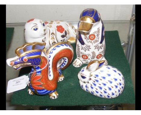 Four Royal Crown Derby animal paperweights including dragon