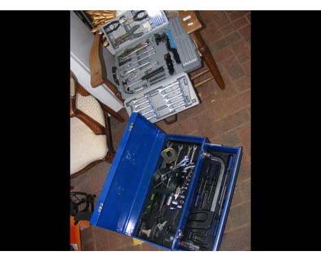 A tool box containing various useful spanners and tools together with one other