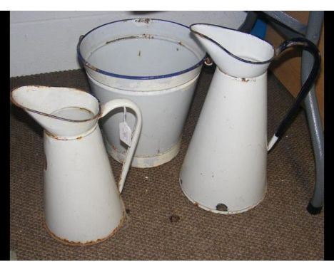 Two vintage enamel jugs together with a bucket
