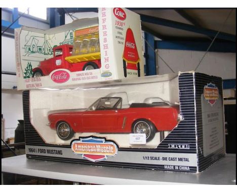 A boxed Ertl Mustang together with Coca-Cola delivery van