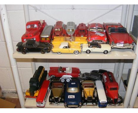 A collection of die cast model vehicles, including Texaco money box - on two shelves 