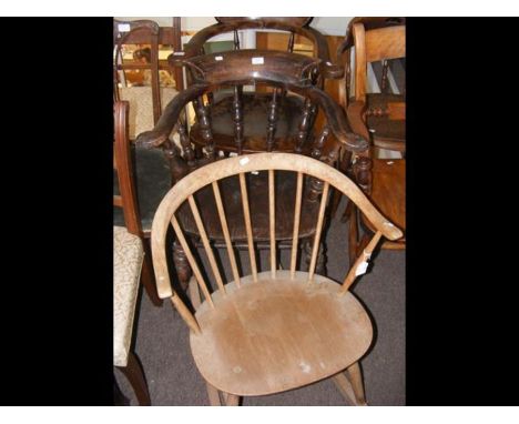 An antique Captain's chair and one other, together with a stick back rocking chair