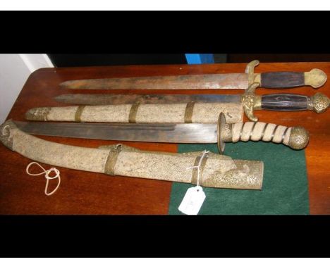 A Middle Eastern curved sword with scabbard, together with one other - 70cm long 