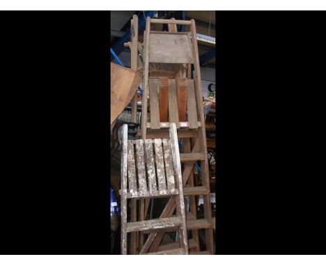 A vintage set of wooden stepladders, together with two others 
