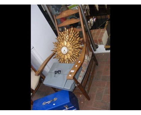 An antique ladder-back armchair
