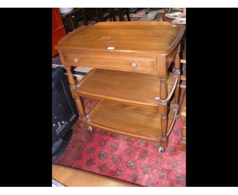 A three tier Ercol tea trolley with single drawer