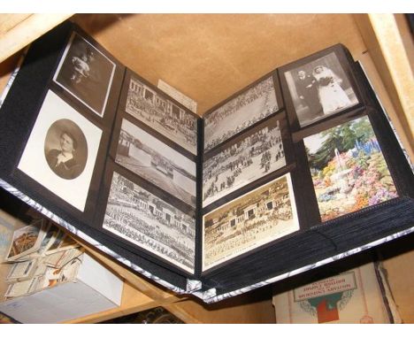 A photo album containing assorted vintage postcards 