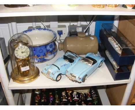 A Kundo German mantel clock under glass dome, together with other collectables 